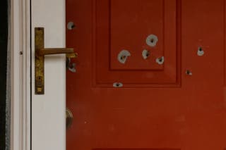 Images show the front door of the State Senator John Hoffman's home after shooting.